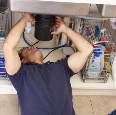 Modesto garbage disposal repair man checks for leaks